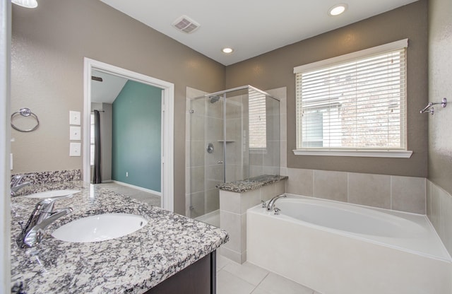 13219 Riata River Ln, Humble, TX 77346 - full bath featuring a shower stall, double vanity, a garden tub, tile patterned floors, and recessed lighting