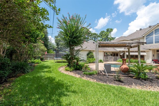 5415 Winding Ridge Dr, Spring, TX 77379 - view of yard with a trampoline, a pergola, an outdoor pool, and a patio