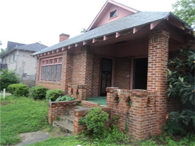 3720 Bell St, Houston, TX 77003 - view of front of property with brick siding and a chimney