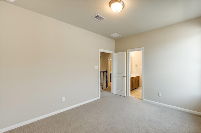 4209 Colony Pines Ln, Houston, TX 77080 - unfurnished bedroom with light carpet, baseboards, and ensuite bath