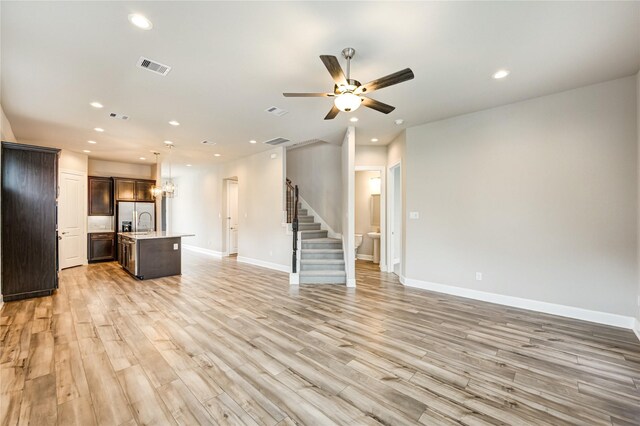 4209 Colony Pines Ln, Houston, TX 77080 - unfurnished living room featuring stairway, recessed lighting, a ceiling fan, light wood finished floors, and baseboards
