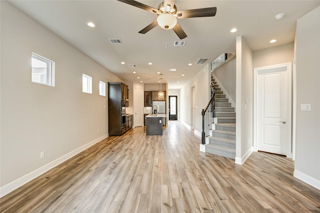 4209 Colony Pines Ln, Houston, TX 77080 - unfurnished living room with stairway, light wood-type flooring, ceiling fan, baseboards, and recessed lighting