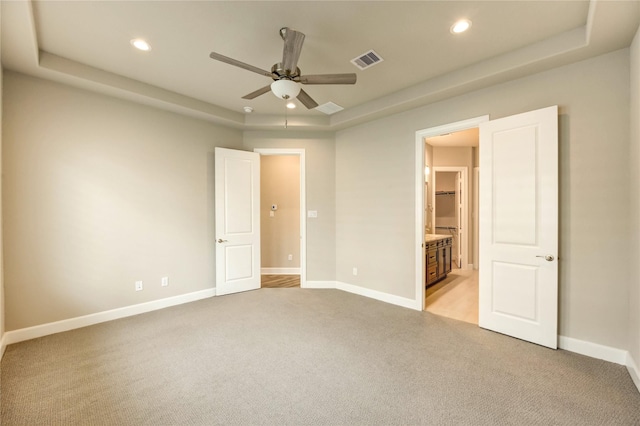 4209 Colony Pines Ln, Houston, TX 77080 - unfurnished bedroom with a tray ceiling, light carpet, recessed lighting, and baseboards
