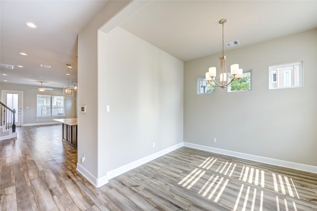 4209 Colony Pines Ln, Houston, TX 77080 - spare room with a chandelier, stairway, light wood finished floors, baseboards, and recessed lighting