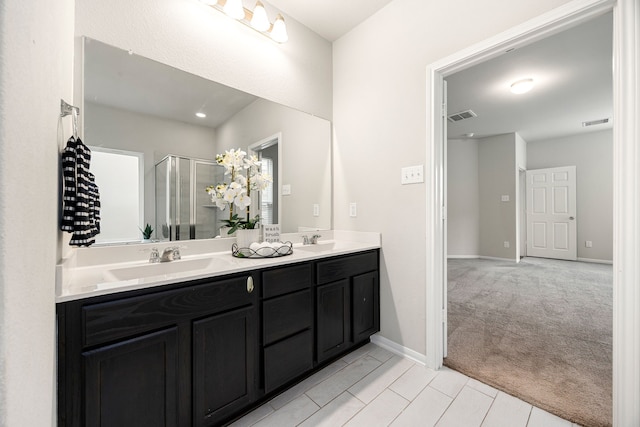 4323 Wyanngate Dr, Spring, TX 77373 - full bath featuring double vanity, a shower stall, baseboards, and recessed lighting