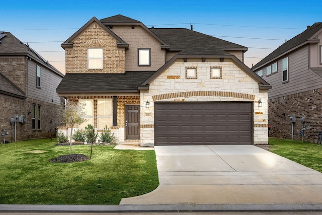 4323 Wyanngate Dr, Spring, TX 77373 - french country style house with a shingled roof, a front yard, concrete driveway, brick siding, and stone siding