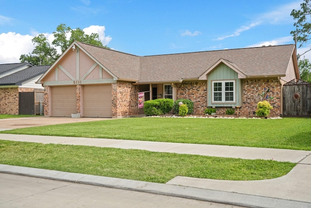 5111 Halbert Dr, Pearland, TX 77581 - view of front facade with an attached garage, brick siding, concrete driveway, and roof with shingles