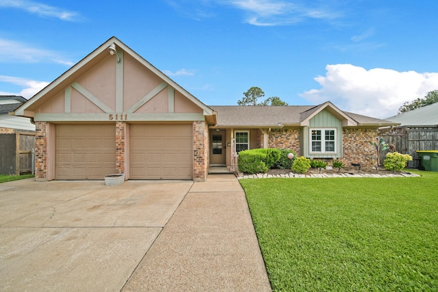 5111 Halbert Dr, Pearland, TX 77581 - view of front of home featuring a garage, driveway, brick siding, and a shingled roof