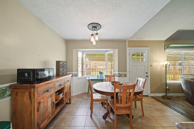 5111 Halbert Dr, Pearland, TX 77581 - dining room with a textured ceiling and light tile patterned floors
