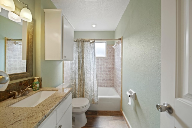 5111 Halbert Dr, Pearland, TX 77581 - full bath with toilet, vanity, a textured ceiling, shower / bath combo, and a textured wall