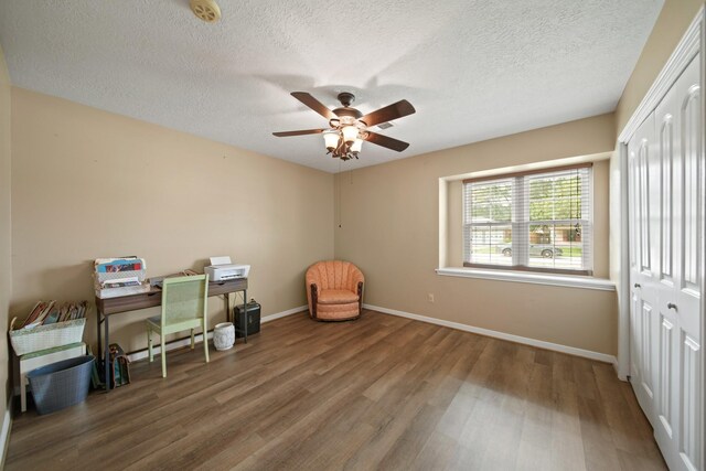 5111 Halbert Dr, Pearland, TX 77581 - office with wood finished floors, a ceiling fan, baseboards, and a textured ceiling