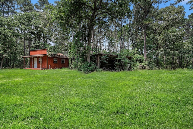 18751 Julie Ln, Magnolia, TX 77355 - view of grassy yard featuring an outdoor structure