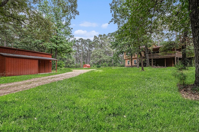 18751 Julie Ln, Magnolia, TX 77355 - view of green lawn with a deck