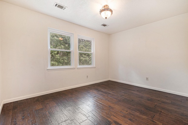 18751 Julie Ln, Magnolia, TX 77355 - unfurnished room with baseboards and dark wood-style flooring