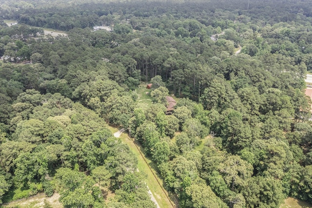 18751 Julie Ln, Magnolia, TX 77355 - aerial view of property and surrounding area featuring a heavily wooded area