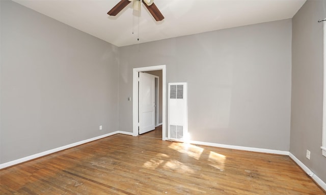 4915 Walker St, Houston, TX 77023 - spare room with a heating unit, wood finished floors, ceiling fan, and baseboards