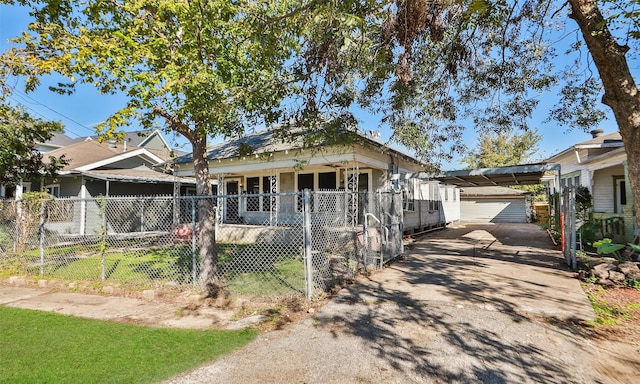 4915 Walker St, Houston, TX 77023 - shotgun-style home with a fenced front yard, an outbuilding, and driveway