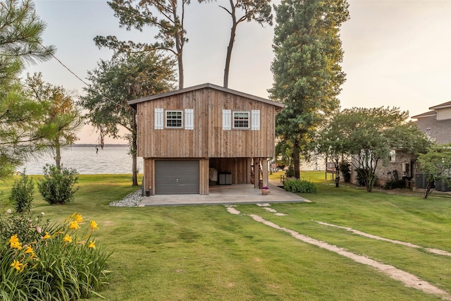 784 W Cattle Dr, Onalaska, TX 77360 - rear view of property with a lawn, a water view, and central AC unit