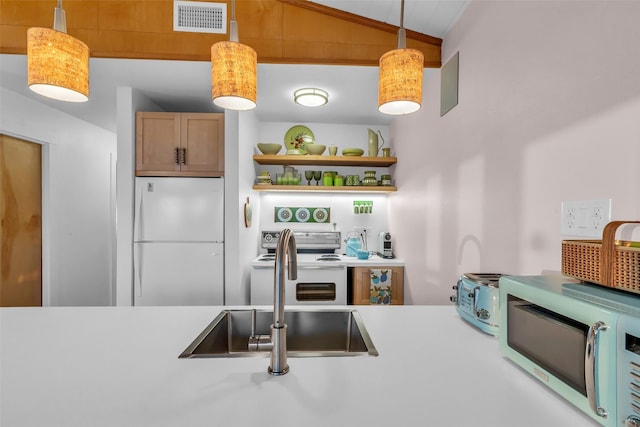 784 W Cattle Dr, Onalaska, TX 77360 - kitchen with white appliances, a sink, light countertops, open shelves, and lofted ceiling