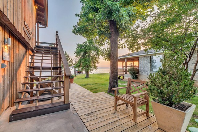 784 W Cattle Dr, Onalaska, TX 77360 - deck with stairs, a water view, and a yard