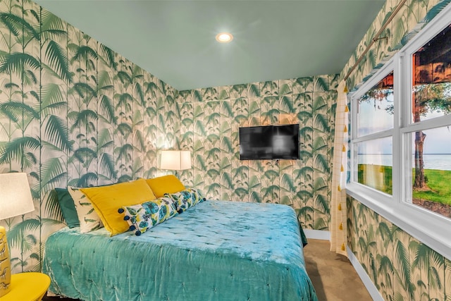 784 W Cattle Dr, Onalaska, TX 77360 - bedroom featuring wallpapered walls, baseboards, an accent wall, and recessed lighting