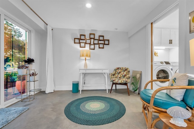 784 W Cattle Dr, Onalaska, TX 77360 - sitting room featuring washer / clothes dryer, concrete floors, baseboards, and recessed lighting