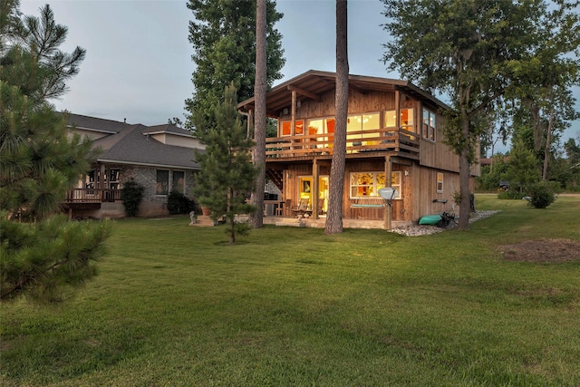 784 W Cattle Dr, Onalaska, TX 77360 - rear view of property featuring a yard and a deck