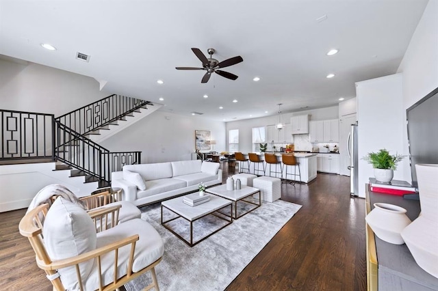 1822 Mcilhenny St Unit B, Houston, TX 77004 - living room featuring ceiling fan, dark wood finished floors, stairway, and recessed lighting