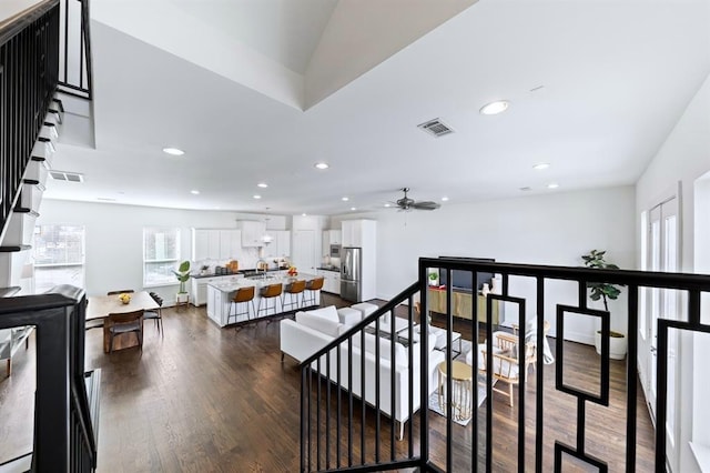 1822 Mcilhenny St Unit B, Houston, TX 77004 - hall with an upstairs landing, recessed lighting, and dark wood-style floors