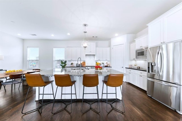 1822 Mcilhenny St Unit B, Houston, TX 77004 - kitchen with appliances with stainless steel finishes, a sink, white cabinetry, dark wood finished floors, and recessed lighting