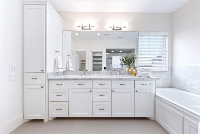 1822 Mcilhenny St Unit B, Houston, TX 77004 - bathroom with double vanity, a garden tub, a shower, and tile patterned floors