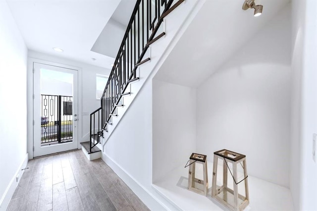 1822 Mcilhenny St Unit B, Houston, TX 77004 - entrance foyer featuring stairway, wood finished floors, recessed lighting, and baseboards