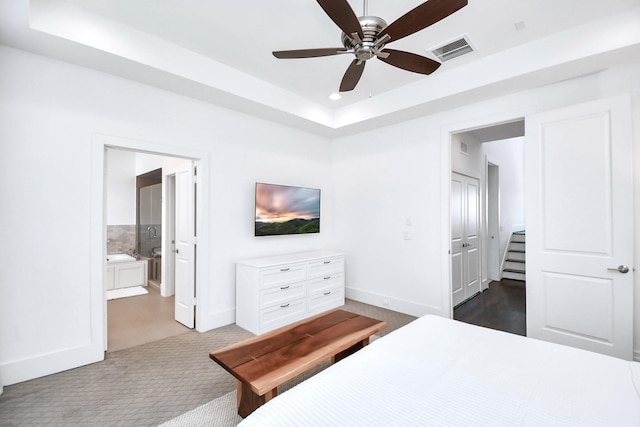 1822 Mcilhenny St Unit B, Houston, TX 77004 - bedroom with baseboards, a tray ceiling, recessed lighting, ensuite bath, and ceiling fan