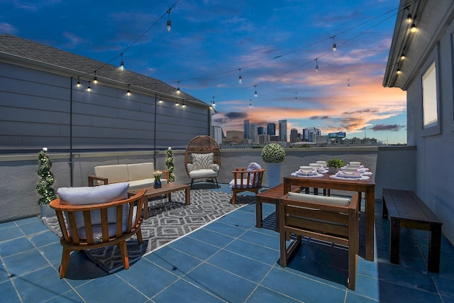 1822 Mcilhenny St Unit B, Houston, TX 77004 - patio terrace at dusk featuring a skyline view and outdoor lounge area