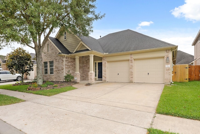 12906 Leafy Shores Dr, Houston, TX 77044 - view of front of house featuring brick siding, a garage, driveway, and roof with shingles