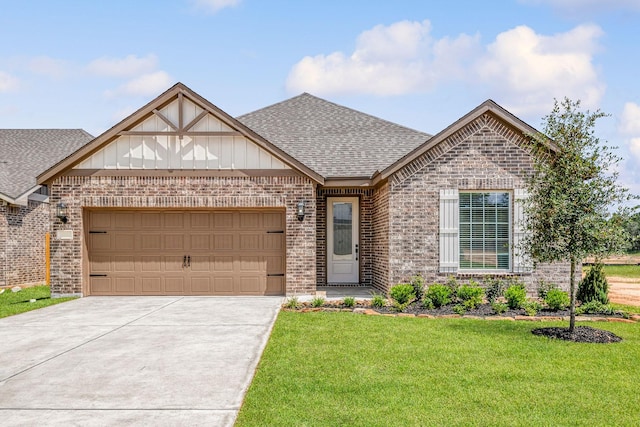 15691 Honey Cove Dr, Conroe, TX 77303 - view of front of property featuring brick siding, a shingled roof, a garage, and a front lawn