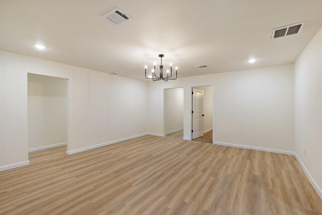 2801 Pickerton Dr, Deer Park, TX 77536 - empty room featuring a chandelier, light wood-style flooring, recessed lighting, and baseboards