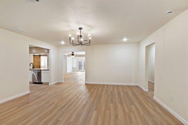 2801 Pickerton Dr, Deer Park, TX 77536 - spare room featuring a chandelier, light wood-type flooring, a smoke detector, and baseboards