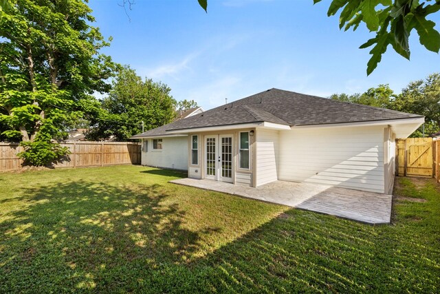 2801 Pickerton Dr, Deer Park, TX 77536 - rear view of house featuring french doors, a patio area, and roof with shingles