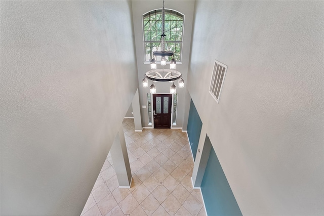 16503 Timberidge Ct, Cypress, TX 77429 - entryway with a chandelier, light tile patterned flooring, and a high ceiling