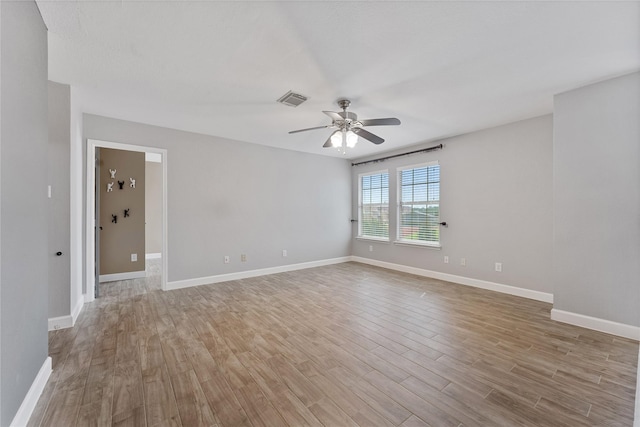 16503 Timberidge Ct, Cypress, TX 77429 - spare room with ceiling fan, light wood-style floors, and baseboards