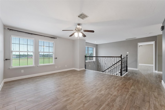 16503 Timberidge Ct, Cypress, TX 77429 - unfurnished room featuring wood finished floors, a ceiling fan, and baseboards