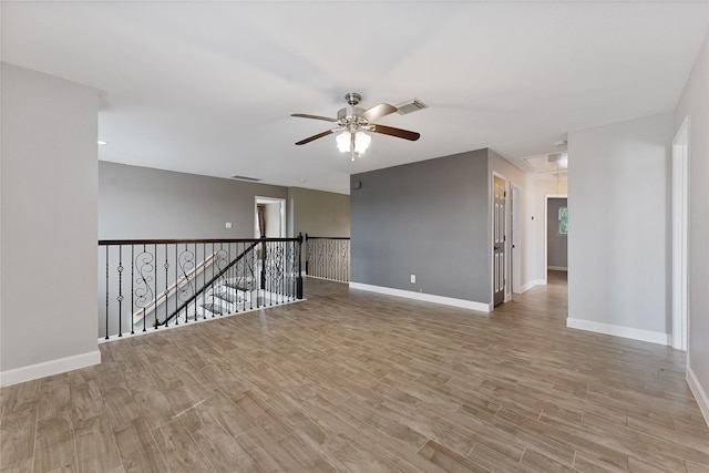 16503 Timberidge Ct, Cypress, TX 77429 - unfurnished room featuring attic access, a ceiling fan, light wood finished floors, and baseboards