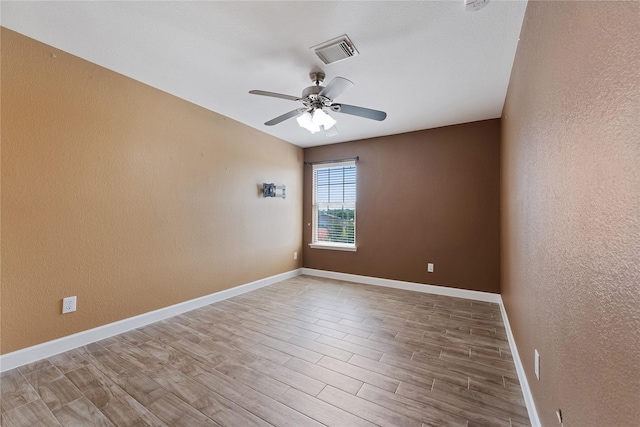 16503 Timberidge Ct, Cypress, TX 77429 - unfurnished room with ceiling fan, wood finished floors, a textured wall, and baseboards