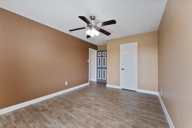 16503 Timberidge Ct, Cypress, TX 77429 - spare room featuring a ceiling fan, light wood-style floors, and baseboards