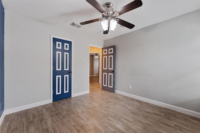 16503 Timberidge Ct, Cypress, TX 77429 - unfurnished bedroom with wood finished floors, baseboards, and ceiling fan