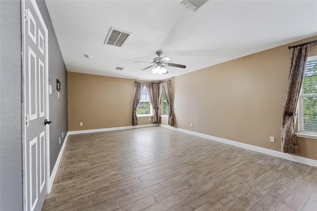 16503 Timberidge Ct, Cypress, TX 77429 - unfurnished room with wood finished floors, a ceiling fan, and baseboards