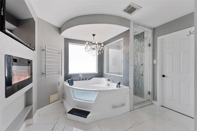 16503 Timberidge Ct, Cypress, TX 77429 - full bathroom featuring marble look tiles, a jetted tub, a shower stall, a chandelier, and baseboards