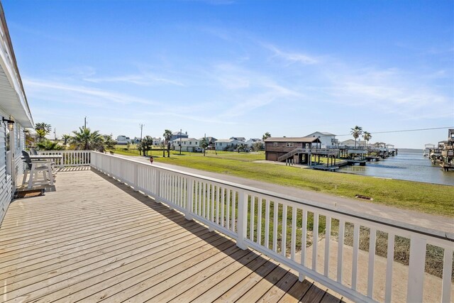 3903 2nd St, Galveston, TX 77554 - deck with a water view, a lawn, and a residential view