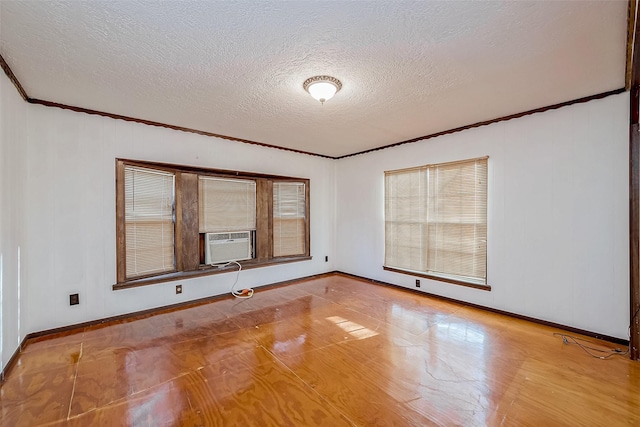 31002 Misty Meadow Dr, Magnolia, TX 77354 - empty room with crown molding, baseboards, a textured ceiling, and cooling unit